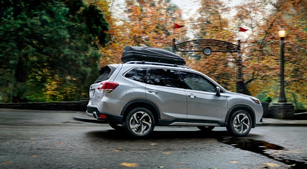 A silver 2023 Subaru Forester is shown from the side.