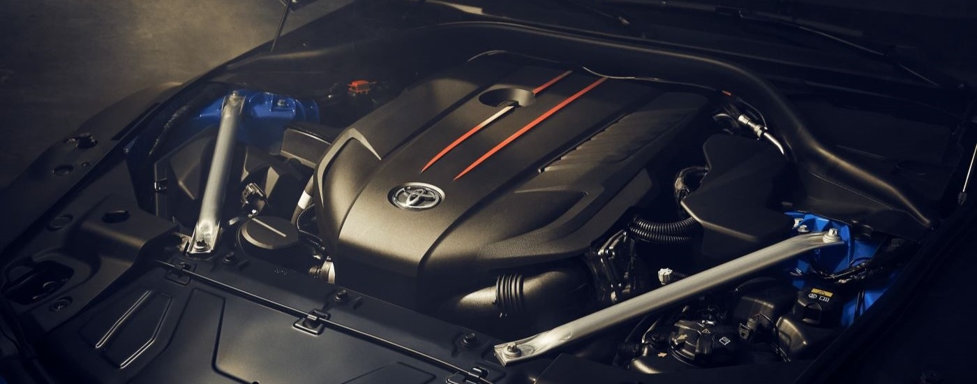 A close up shows the engine in a blue 2024 Toyota GR Supra.