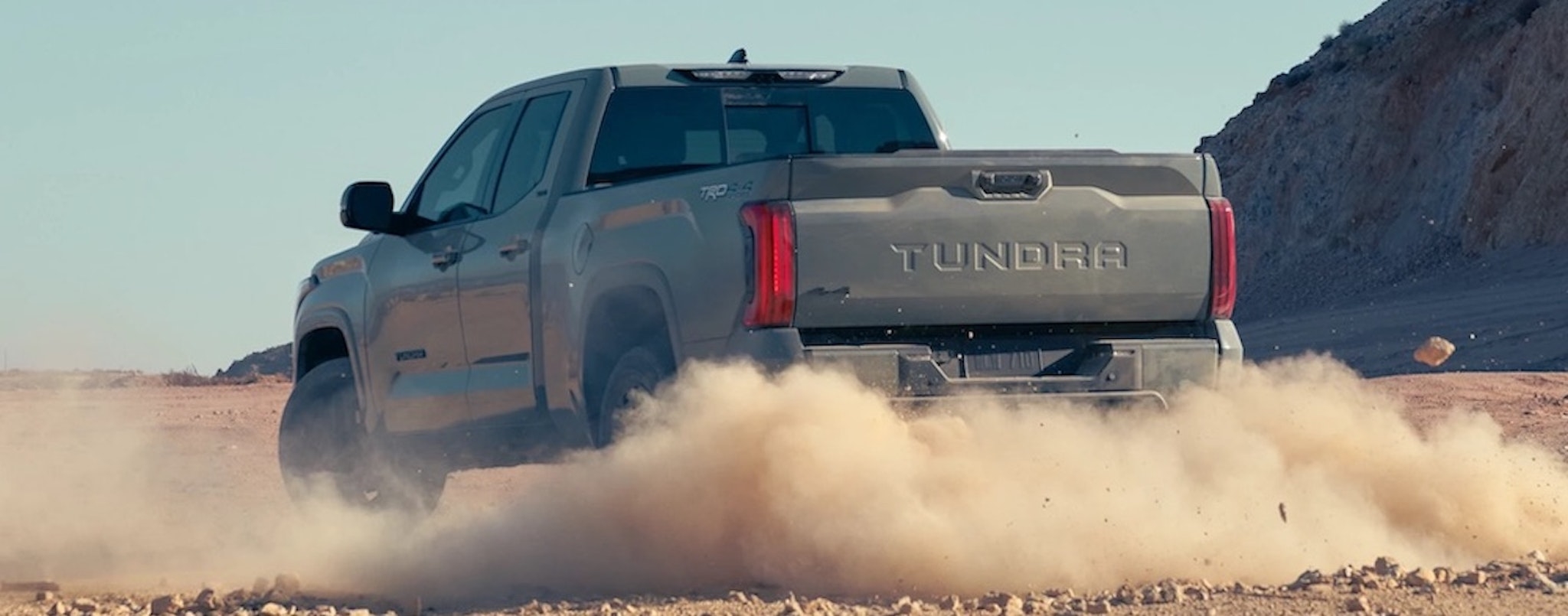 A grey 2022 Toyota Tundra is shown from the rear at an angle.