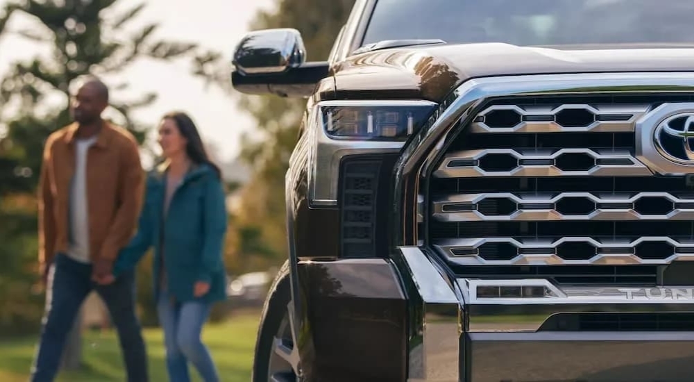 The front of a black 2022 Toyota Tundra 1794 Crewmax leaving a used Toyota dealer near Brattleboro, VT.