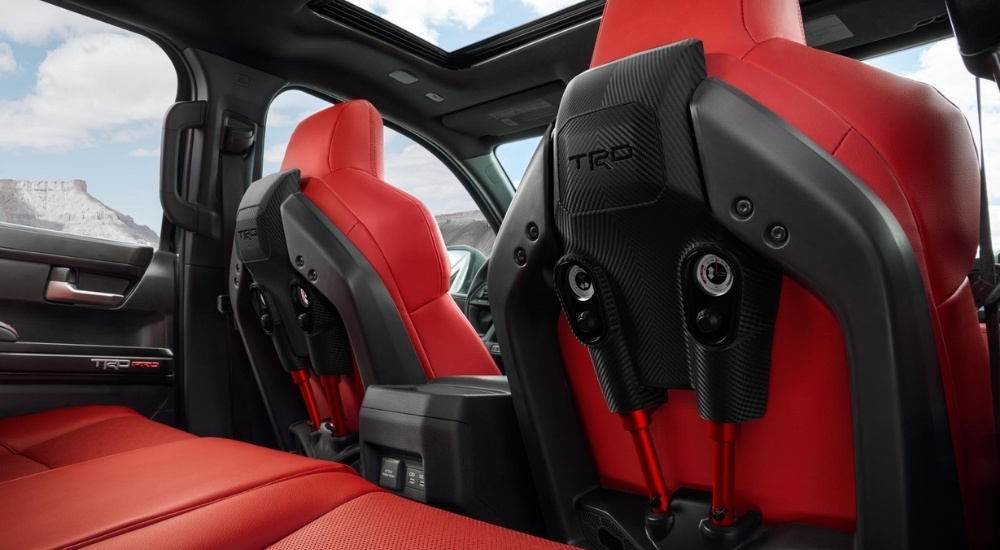 The red and black IsoDynamic seats in a 2024 Toyota Tacoma TRD Pro are shown.