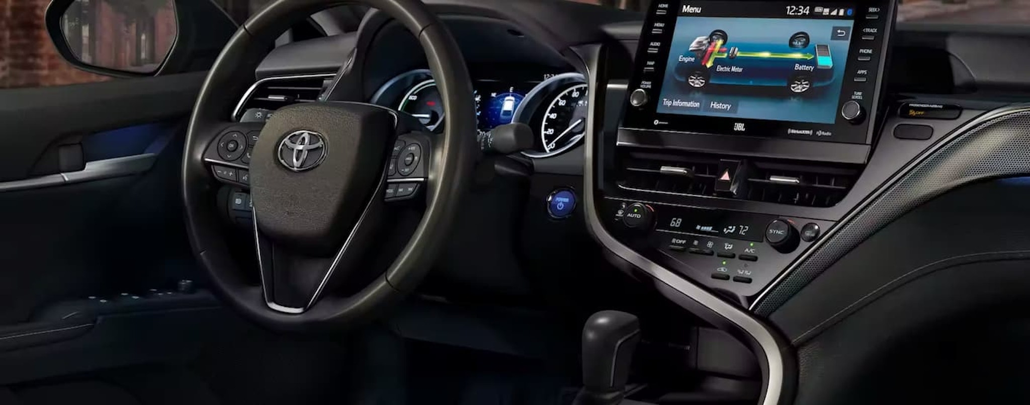 A close up shows the dash and infotainmetn screen in a 2023 Toyota Camry.