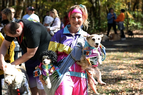 Woman and dogs dressed in Halloween costumers at Windber Recreational Park