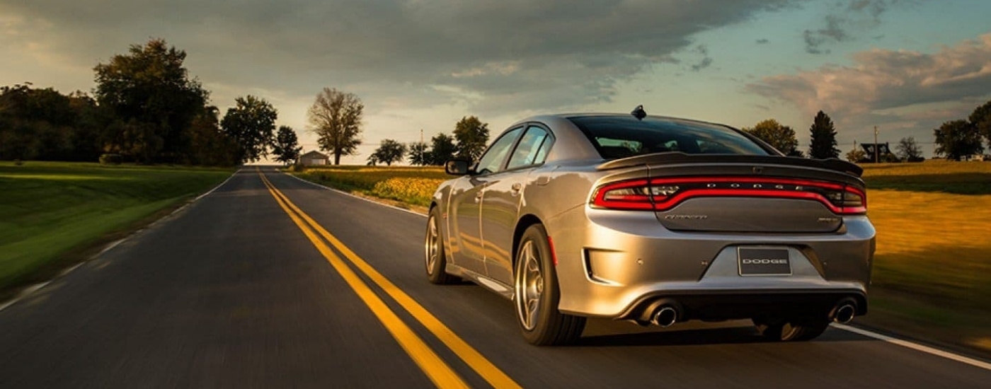 A silver 2017 Dodge Charger SRT is shown driving to a Dodge dealer in Poughkeepsie.