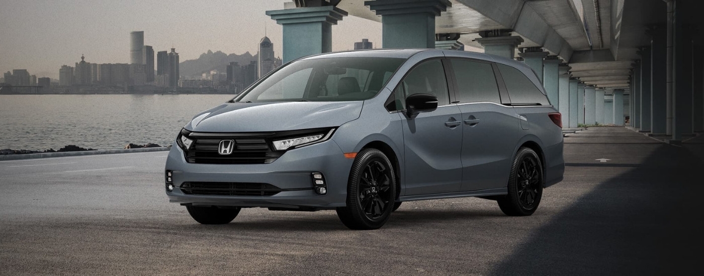 A grey 2023 Honda Odyssey is shown after leaving a Honda dealer near Cottage Lake.