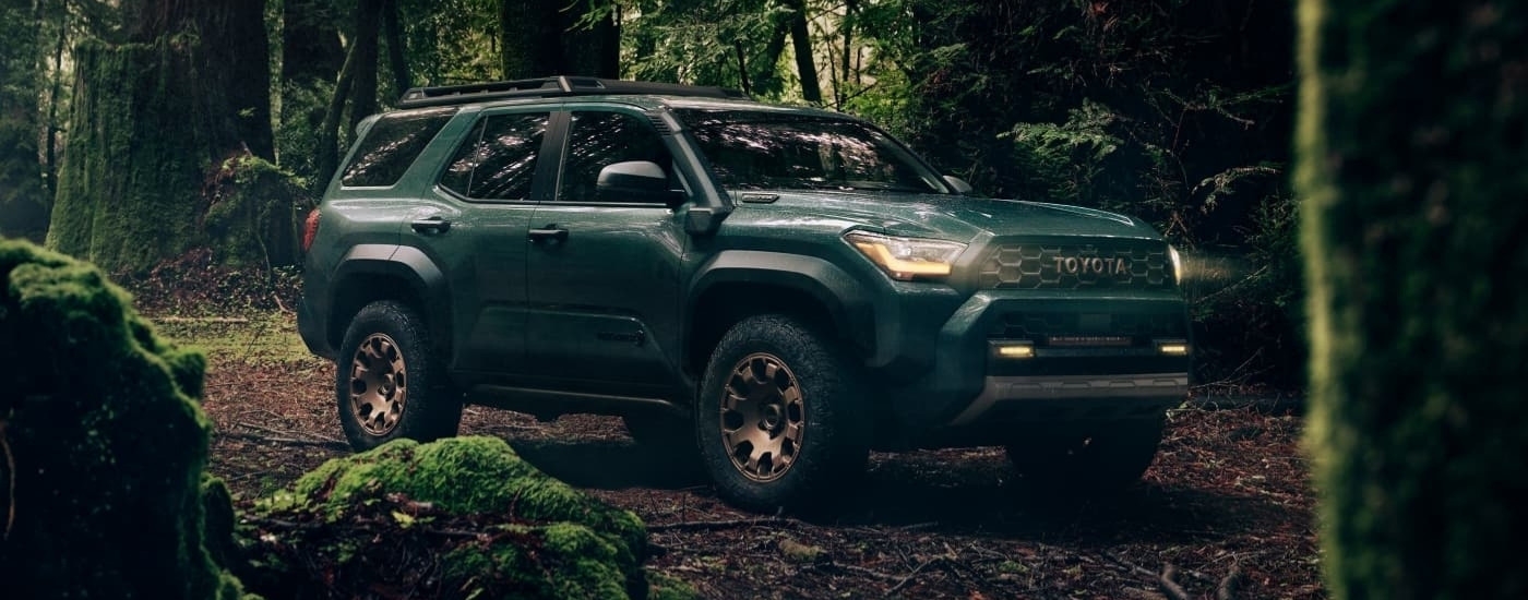 A green 2025 Toyota 4Runner Trailhunter is shown off-road after leaving a Toyota dealer near Bennington.