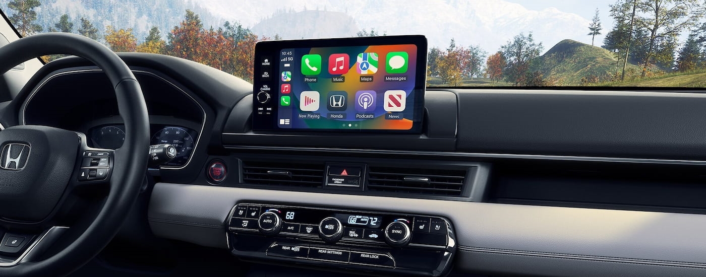 The dashboard and infotainment screen in a 2025 Honda Pilot Elite.