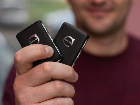 person holding a set of Volvo car keys at the Volvo Cars Mission Viejo dealership in Mission Viejo, CA