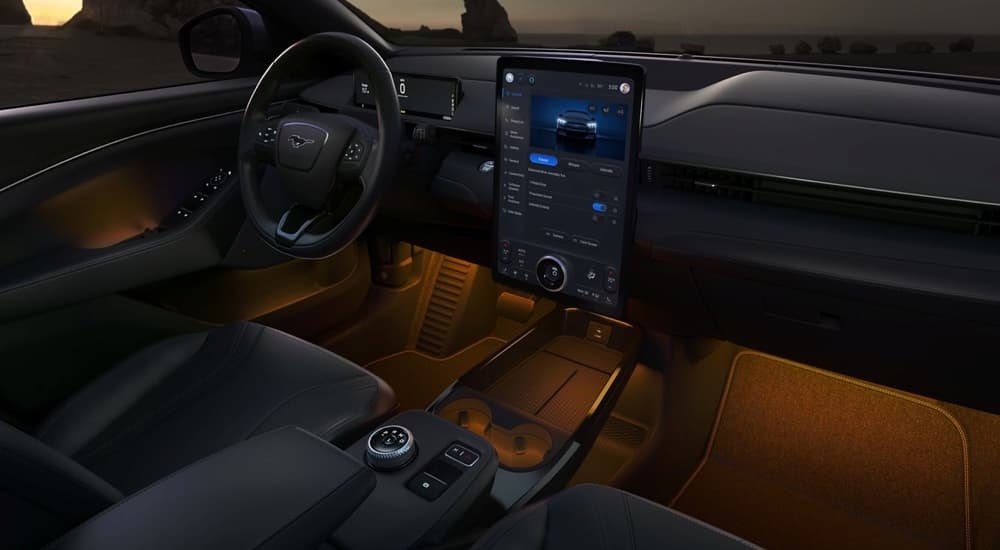 Orange ambient lighting in the cabin of a 2024 Ford Mustang Mach-E for sale near Keene.