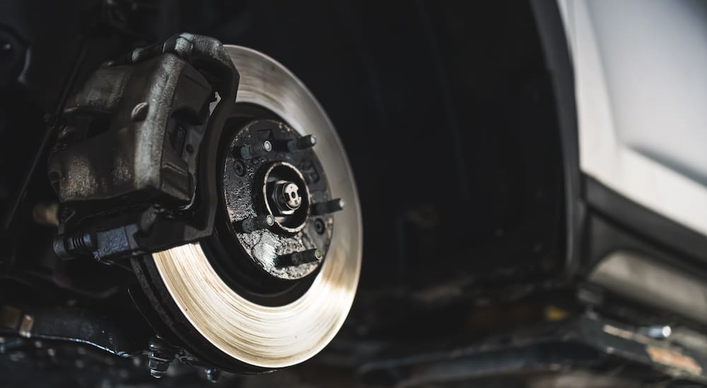 Close-up of vented brake rotors on a vehicle during brake service.