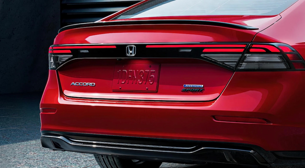 Rear view of a red 2025 Honda Accord Sport-L Hybrid.