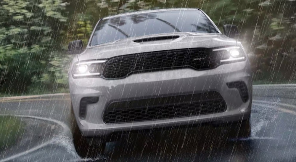 Head-on view of a grey 2024 Dodge Durango SRT driving in the rain.