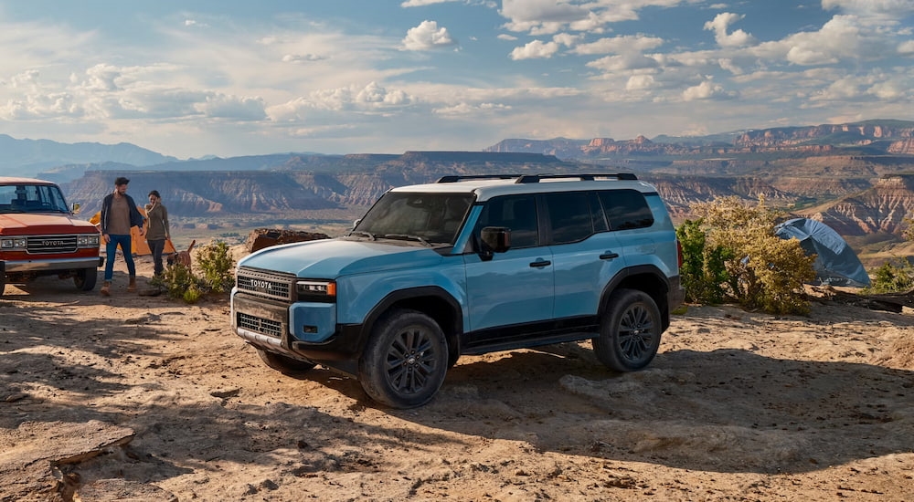 A blue 2025 Toyota Land Cruiser parked off-road and angled left.