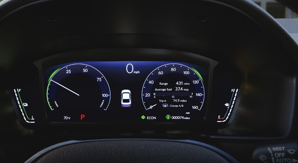 A close-up shows the digital gauges in a 2023 Honda Accord.