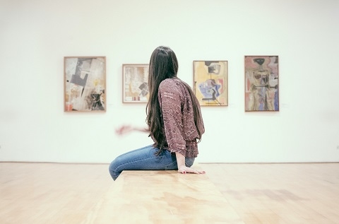 person sitting in an art gallery in Albuquerque, NM