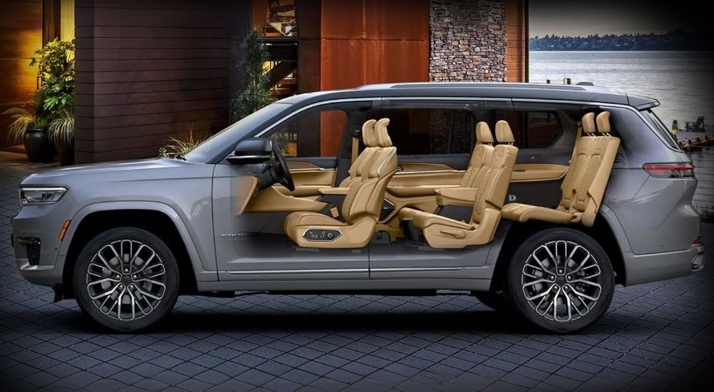 A side view of a grey 2025 Jeep Grand Cherokee L with a simulated x-ray of the three row seats.