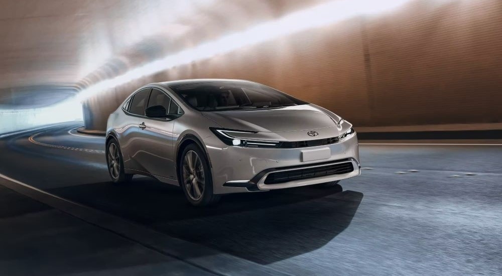 A grey 2023 Toyota Prius Limited driving through a tunnel from a Toyota dealer near Glasgow.