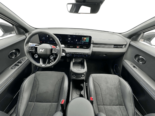 Interior view of the Hyundai Ioniq 5 N showing the front and rear seats with modern technology.