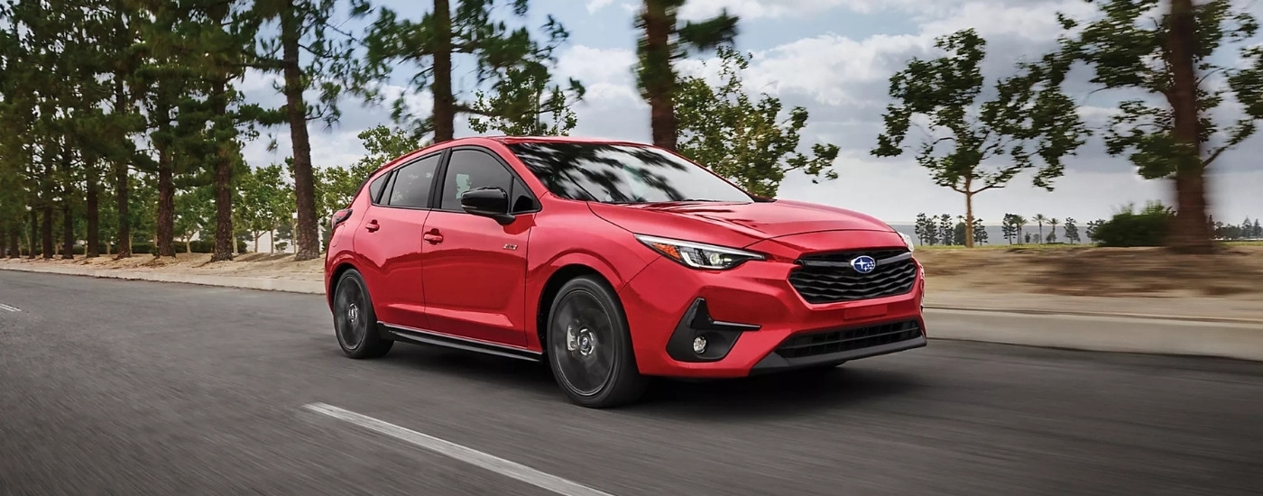 A red 2025 Subaru Impreza for sale near Poughkeepsie is shown from the front at an angle.