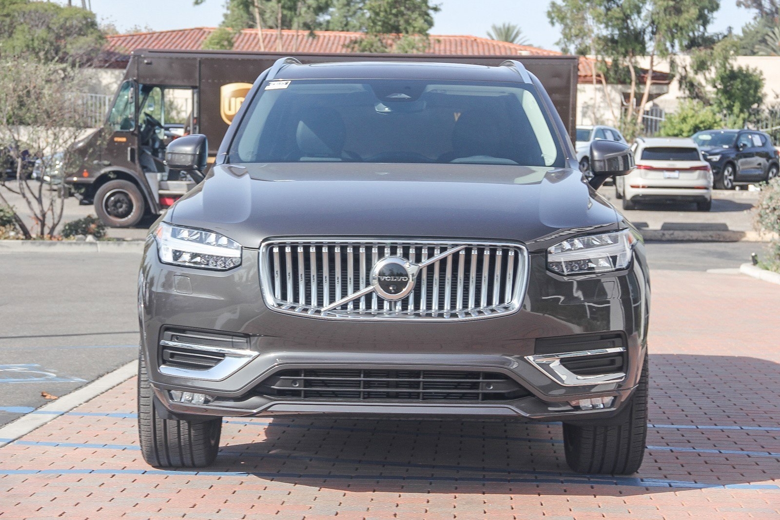 grey 2025 Volvo XC60 SUV parked at the Volvo Cars Mission Viejo dealership in Mission Viejo, CA