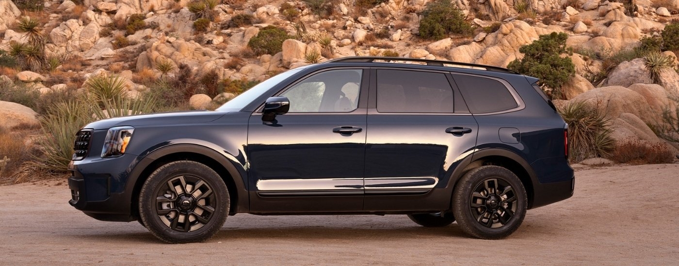 A blue 2025 Kia Telluride for sale near Corpus Christi is shown from the side.