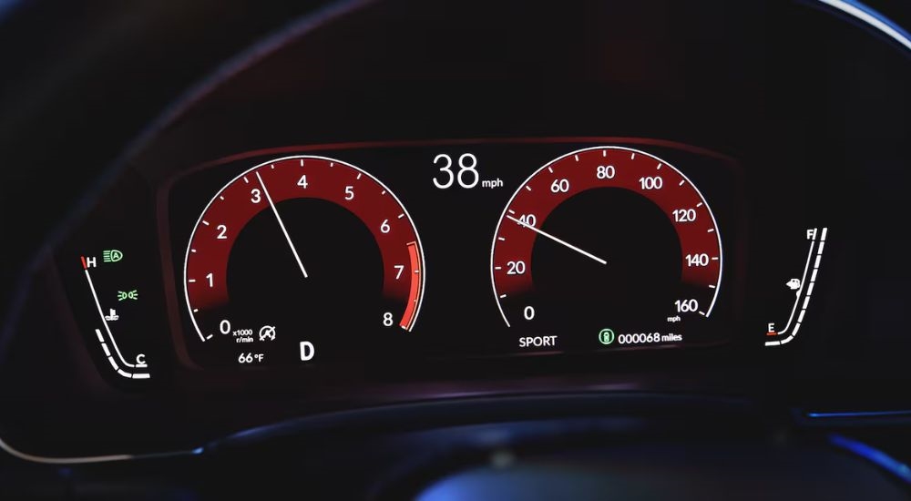 Close-up of the digital instrument cluster in a 2023 used Honda Civic for sale near Union City.