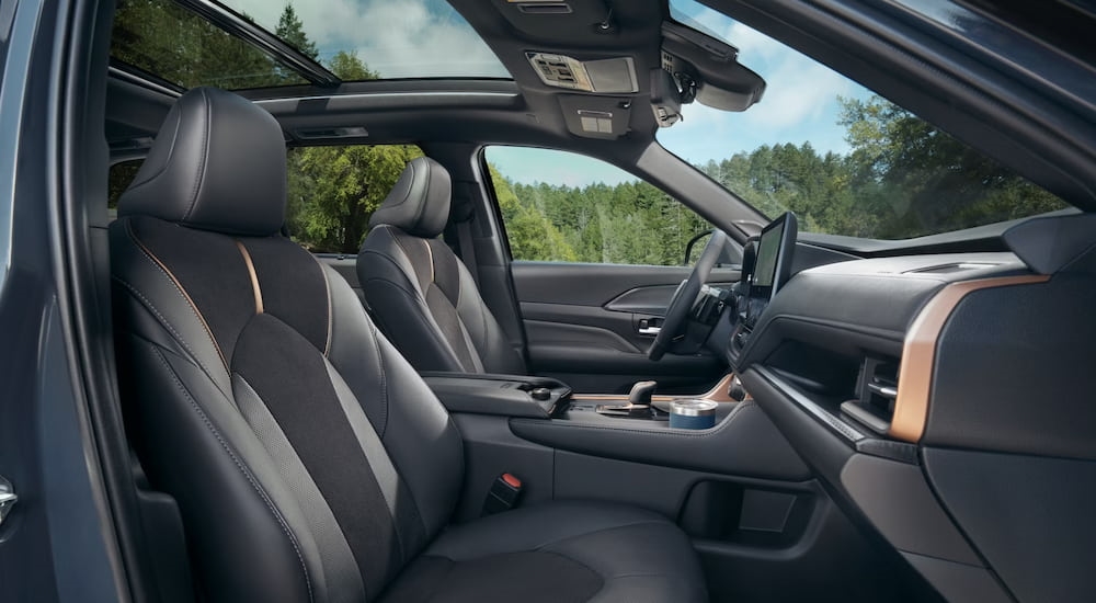 Side view into the black interior of a 2025 Toyota Grand Highlander for sale.