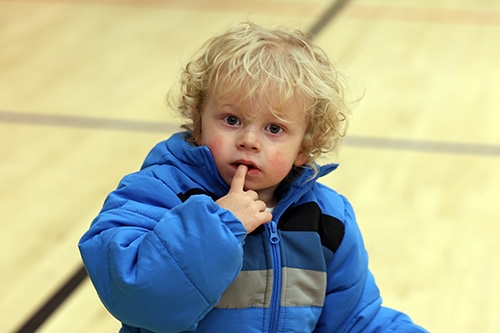 Child wearing brand new coat given to him during Operation Warm at the Johnstown YMCA