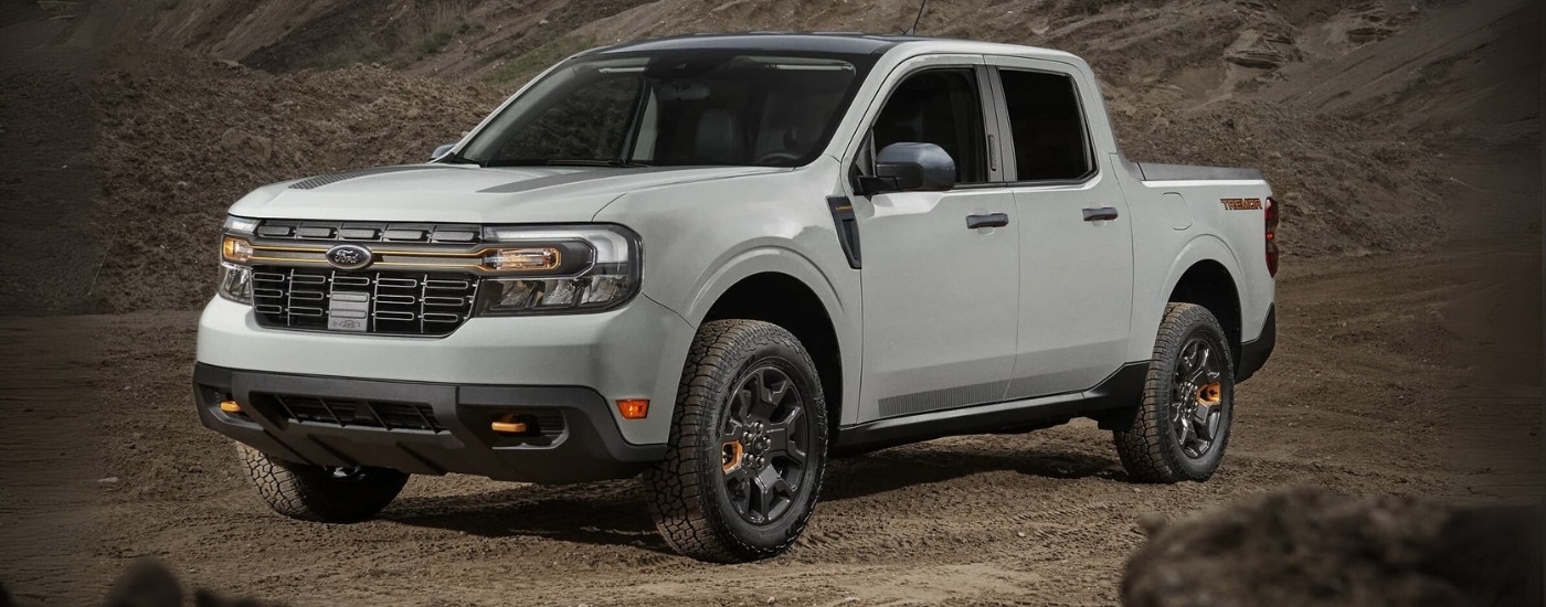 A white 2023 Ford Maverick Tremor is shown parked off-road.