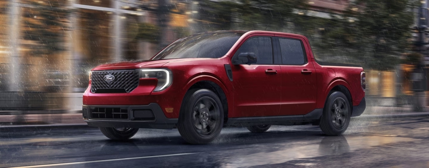 A red 2025 Ford Maverick for sale in Rhinebeck is shown driving through rain.