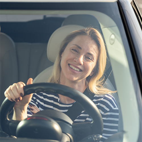 happy woman enjoy driving new car