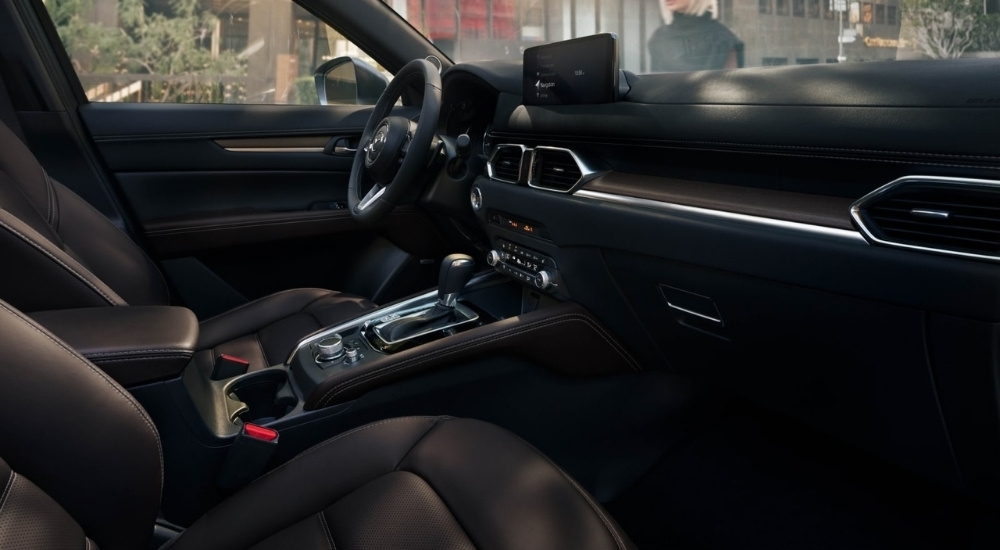 The interior of a 2025 Mazda CX-5 is shown from the passenger side.