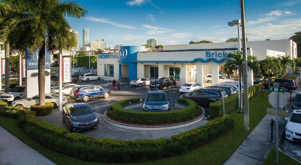 Brickell Honda dealership on SW 8th Street in Miami, seen from above with the Honda sign and palm-lined entrance