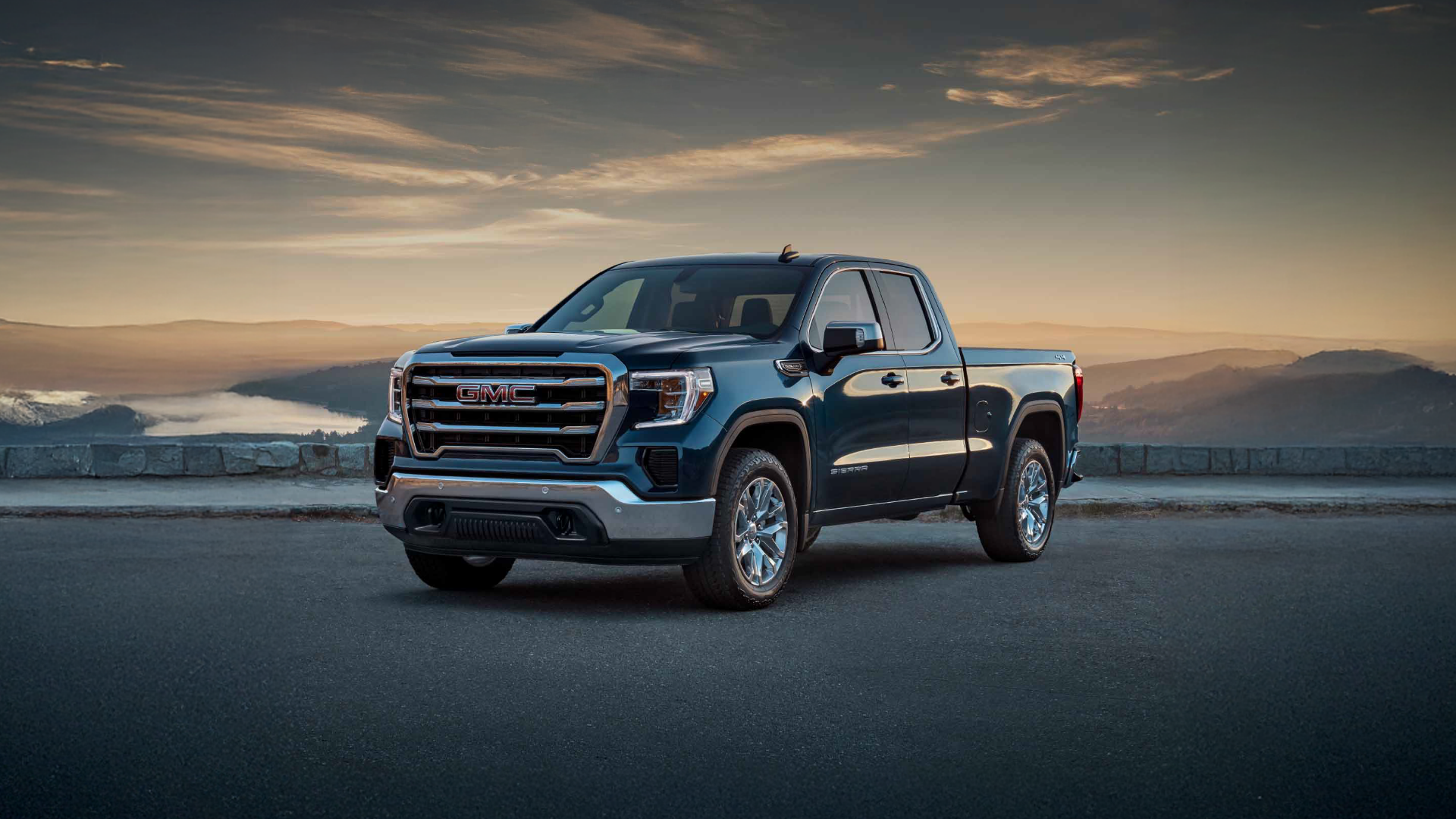 GMC Pickup Truck facing west with a sunset in the background