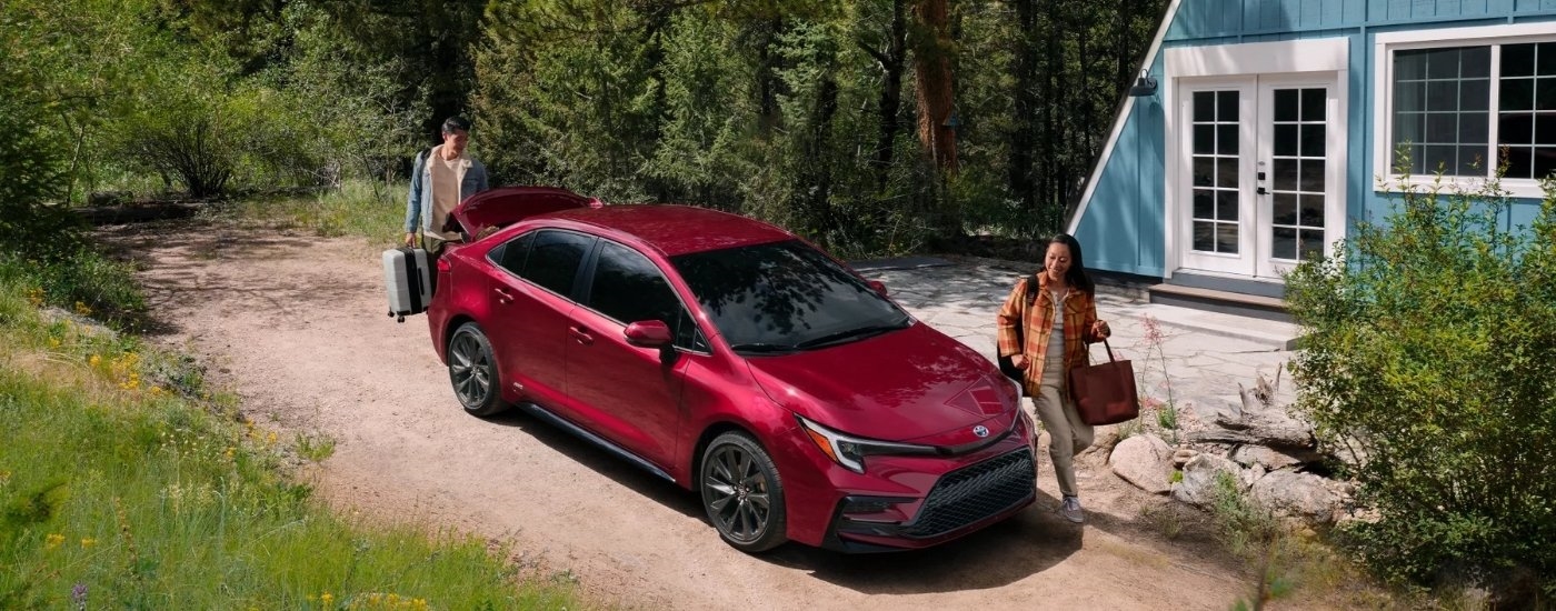 A red 2025 Toyota Corolla for sale is shown from the front at an angle.