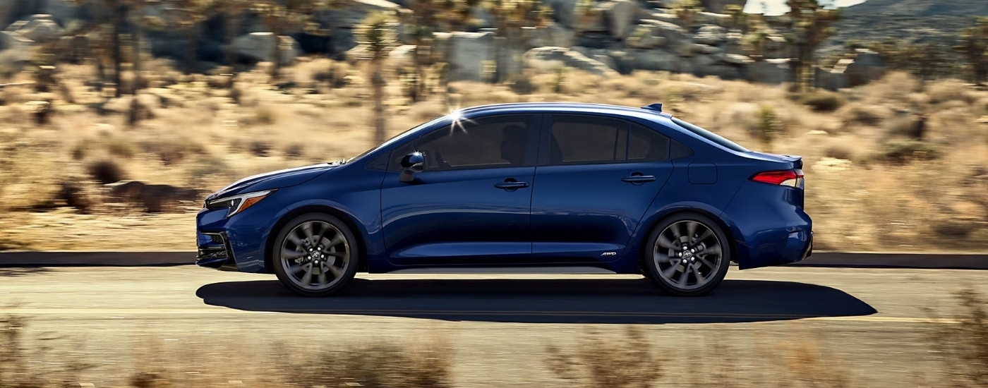 A blue 2025 Toyota Corolla is shown from the side.