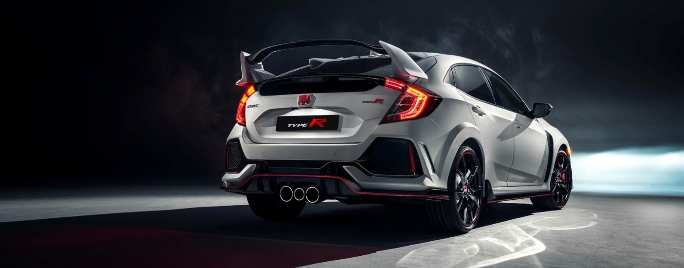 A white 2017 Honda Civic Type R parked at night.