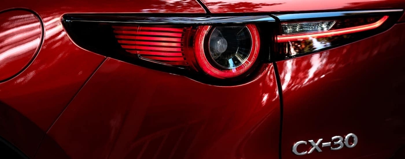 Driver side taillight on a red 2021 Mazda CX-30.