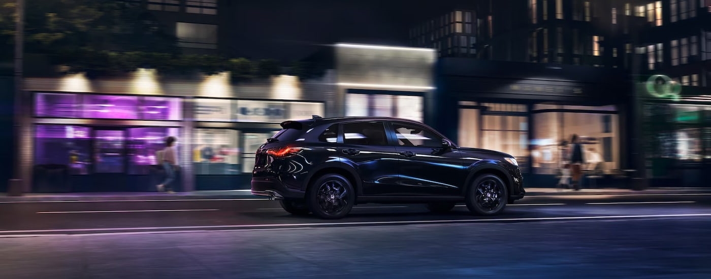 A black 2025 Honda HR-V on a city street.