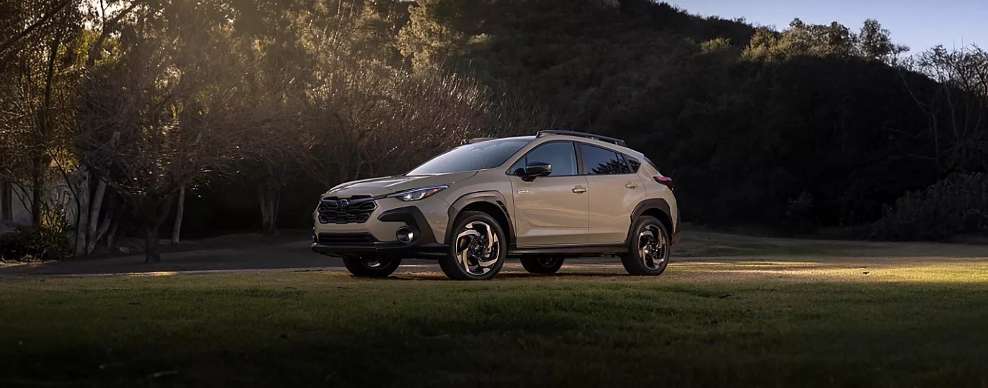 A grey 2025 Subaru Crosstrek for sale near Millbrook parked on grass.