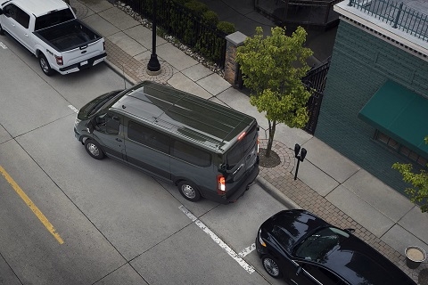grey ford transit van parking on a street in Albuquerque, NM