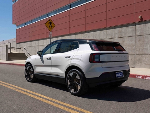 white 2025 volvo EX30 electric crossover driving down the street in mission viejo, CA