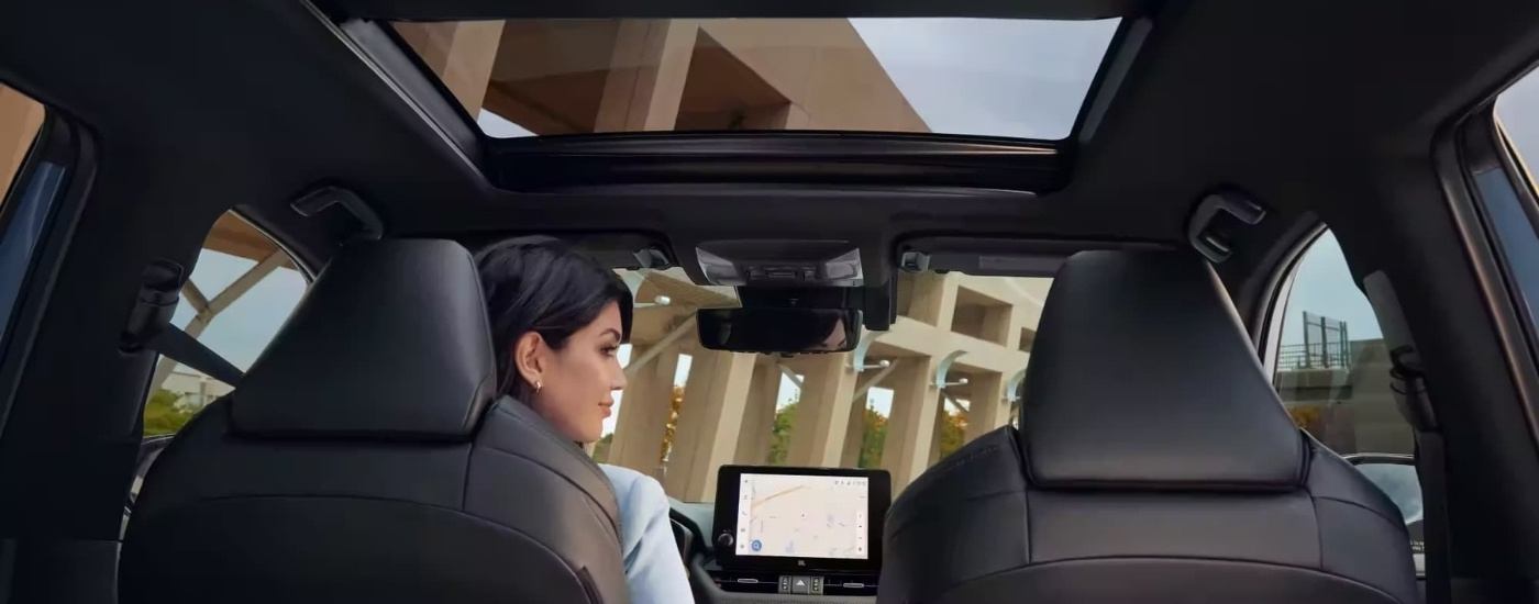 Black interior and moonroof in a 2023 Toyota RAV4.