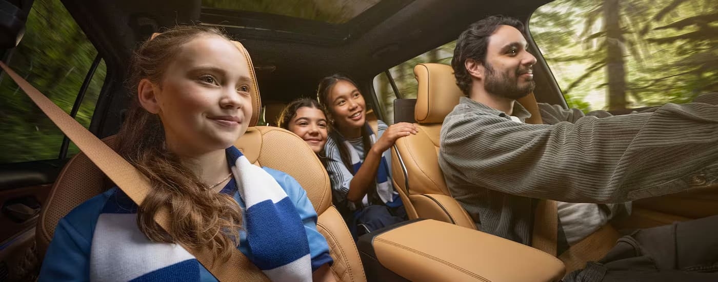 A family test driving a 2025 Jeep Grand Cherokee for sale in Rhinebeck.