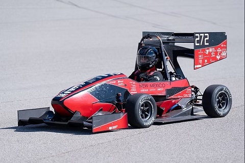 University of New Mexico's FSAE electric car driving on a track in Albuquerque, NM