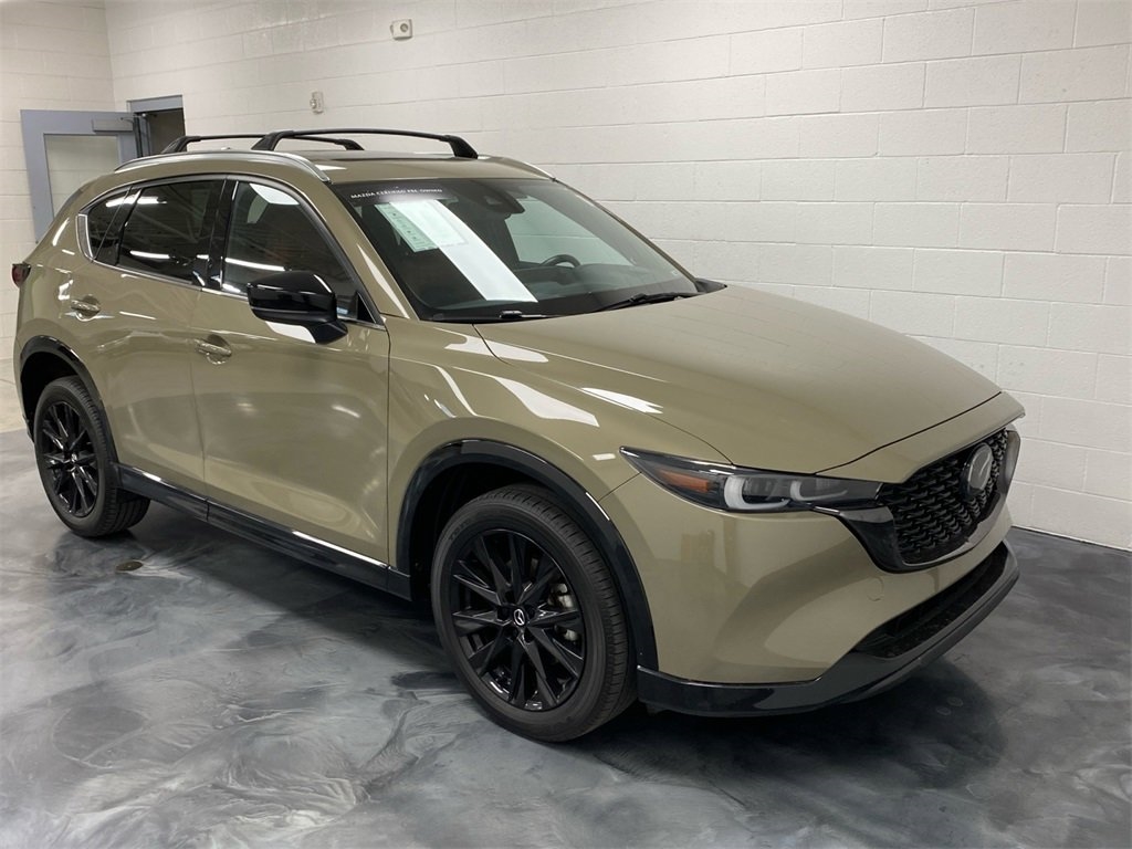 tan 2024 Mazda CX-5 SUV parked at the Bountiful Mazda dealership in Bountiful, UT