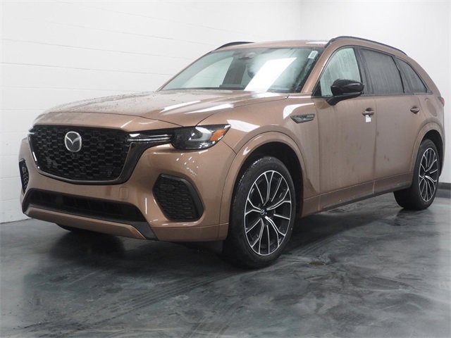 bronze 2025 Mazda CX-70 SUV parked at the Bountiful Mazda dealership in Bountiful, UT