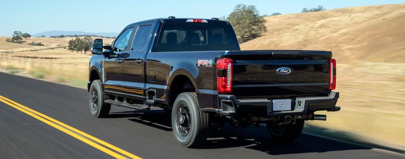 A black 2025 Ford F-250 from the rear.