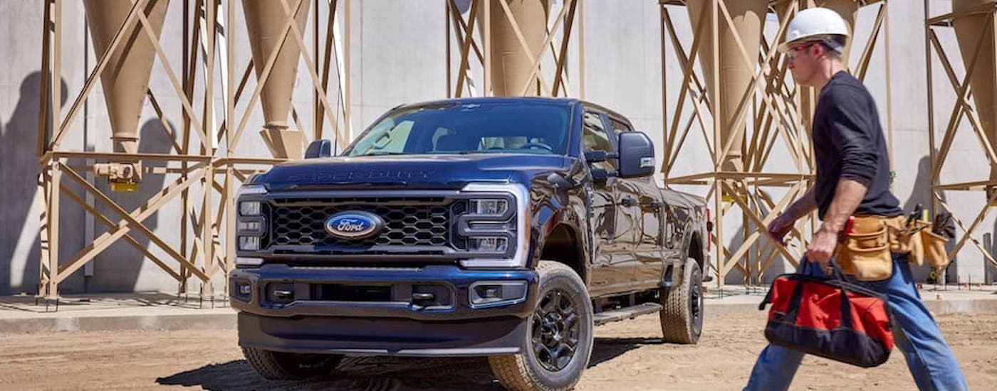 A blue 2025 Ford F-250 from the front.