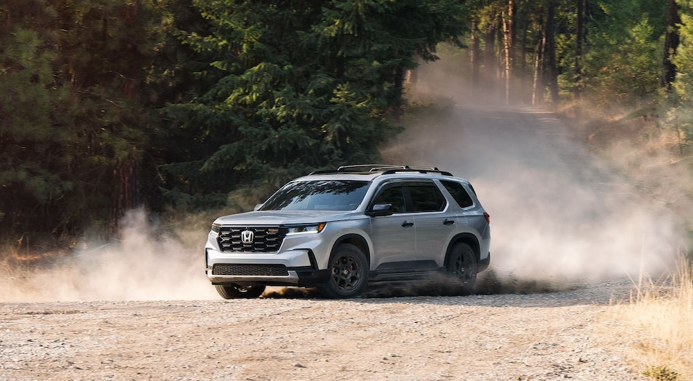 White 2025 Honda Pilot TrailSport for sale near Shoreline driving off-road.